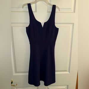 Navy cocktail dress with V-cut. No zipper. Size M